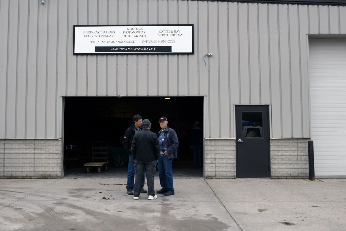 096 Jim Conner, Leo Epp and Arvid Janzen outside the Kalona Sales Barn.JPG